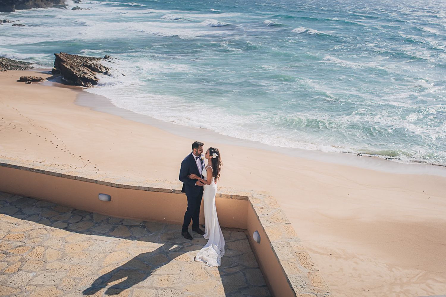 A romantic moment between the bride and groom during their Indian Destination Wedding in Portugal at arriba by the sea wedding venue
