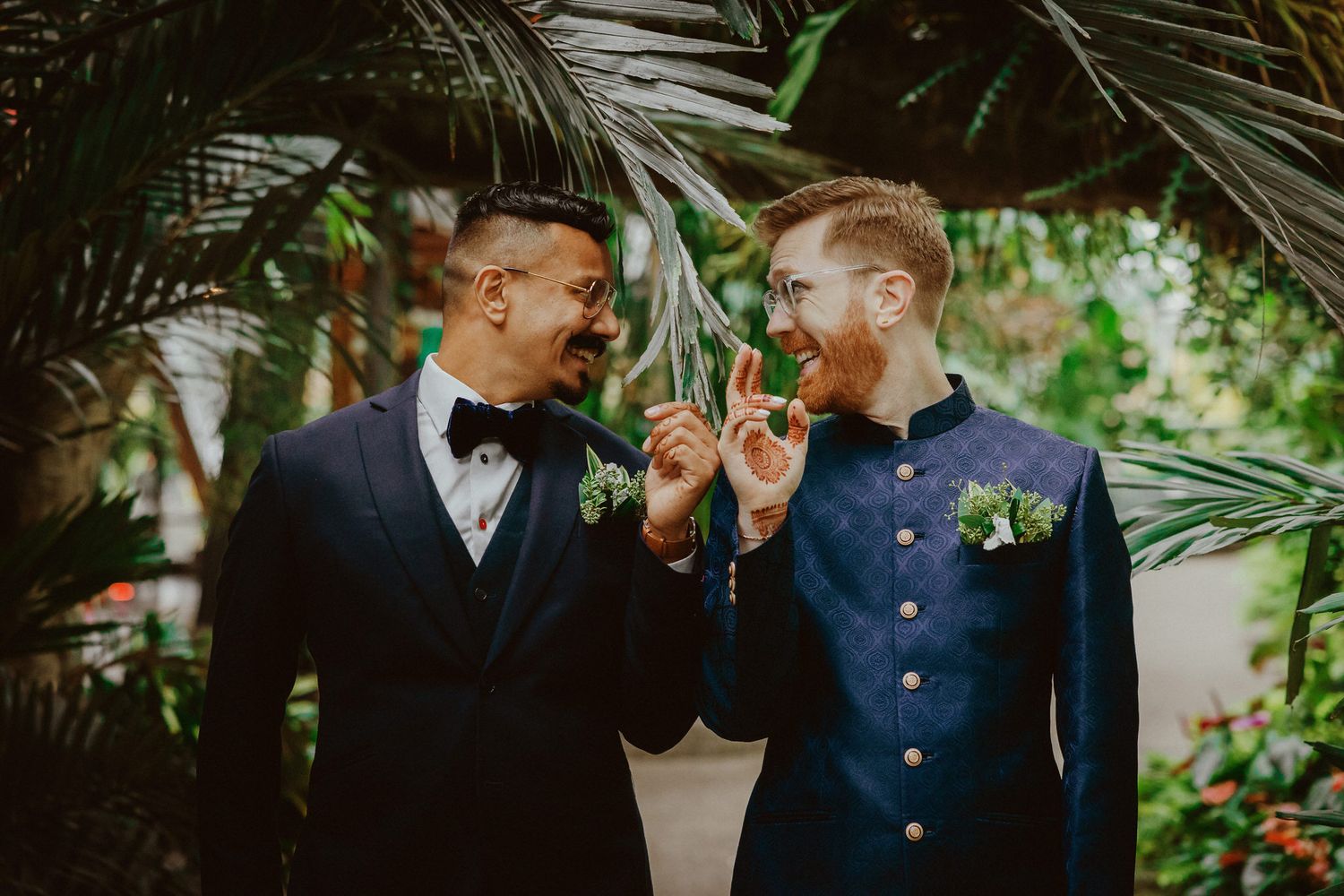 Candid moment between bride and groom at Calgary Zoo, captured by a Calgary wedding photographer focused on authentic love stories.