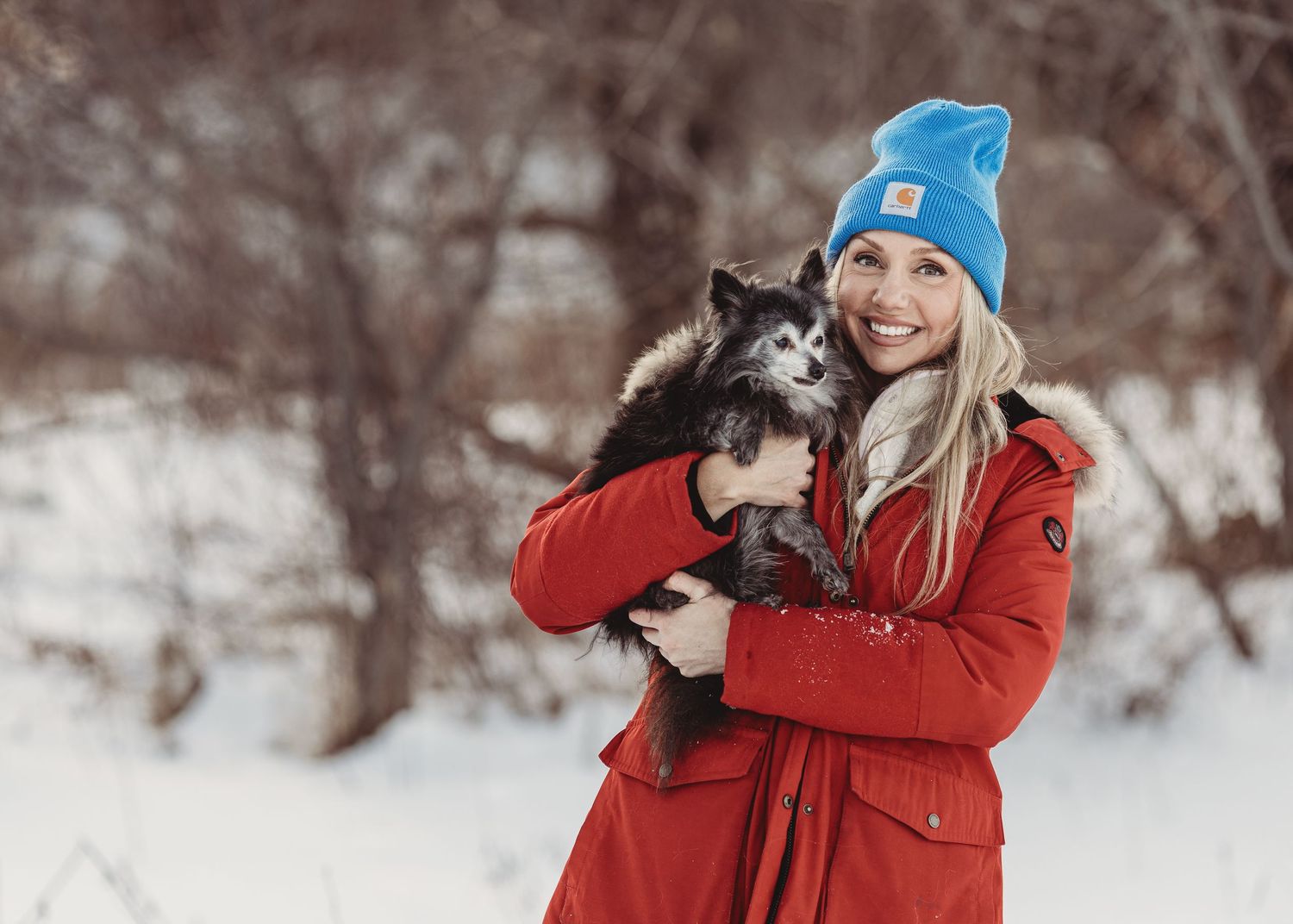 Professional photo of a woman with her senior dog