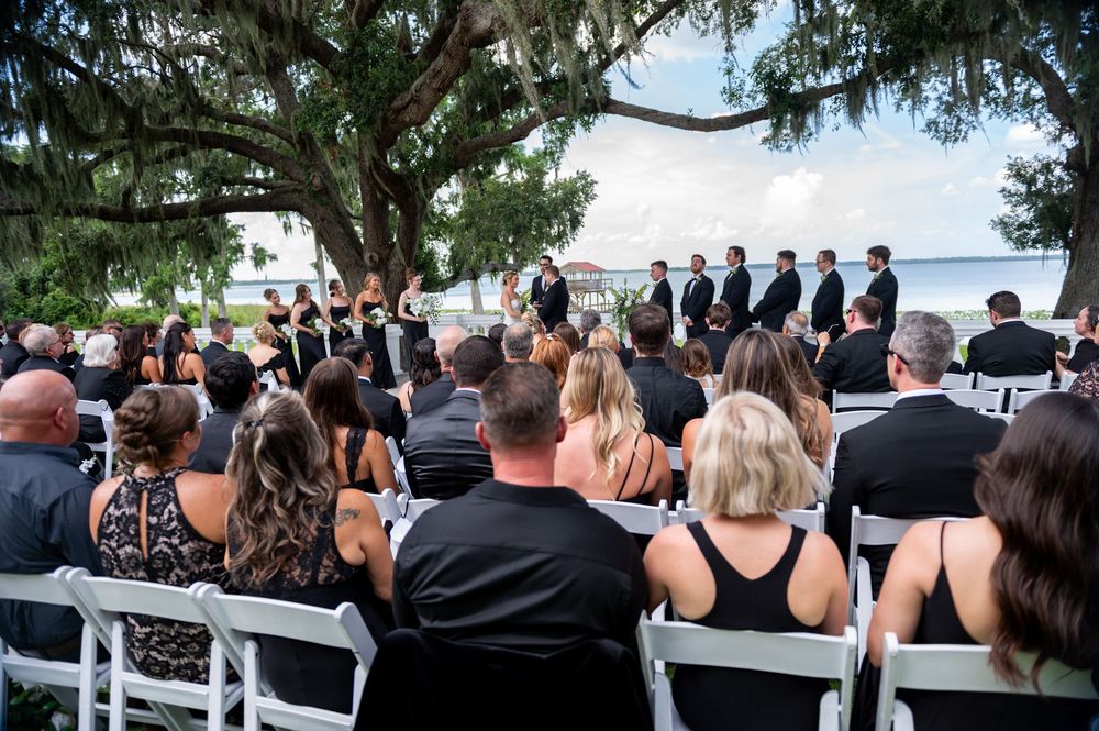 Bride and groom framed by arched villa entrance at Bella Cosa wedding venue