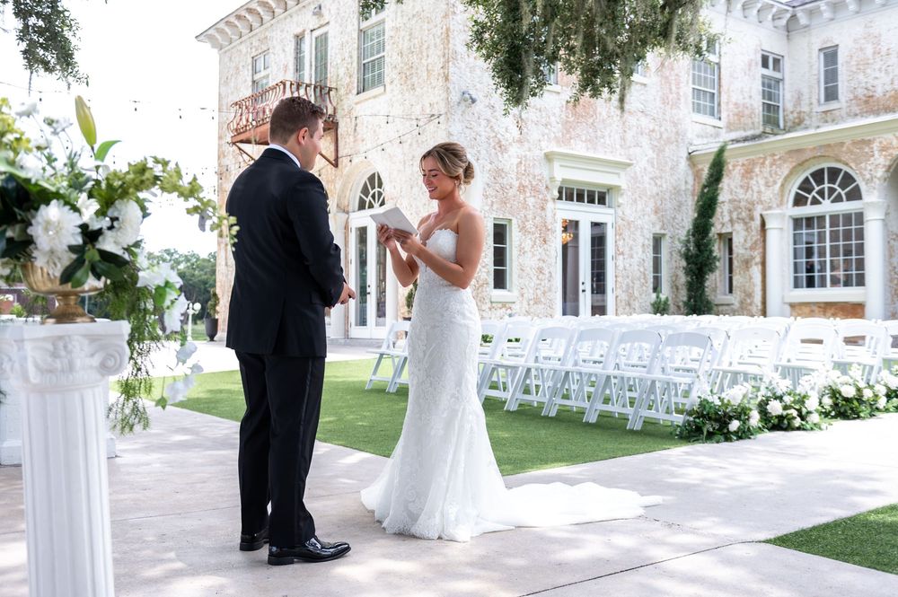 Couple dancing under chandeliers at Bella Cosa wedding reception