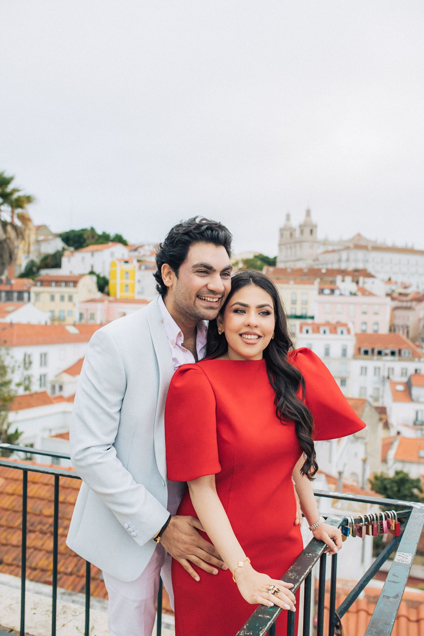 Indian couple walking through the streets of Baixa, Lisbon during their engagement session.