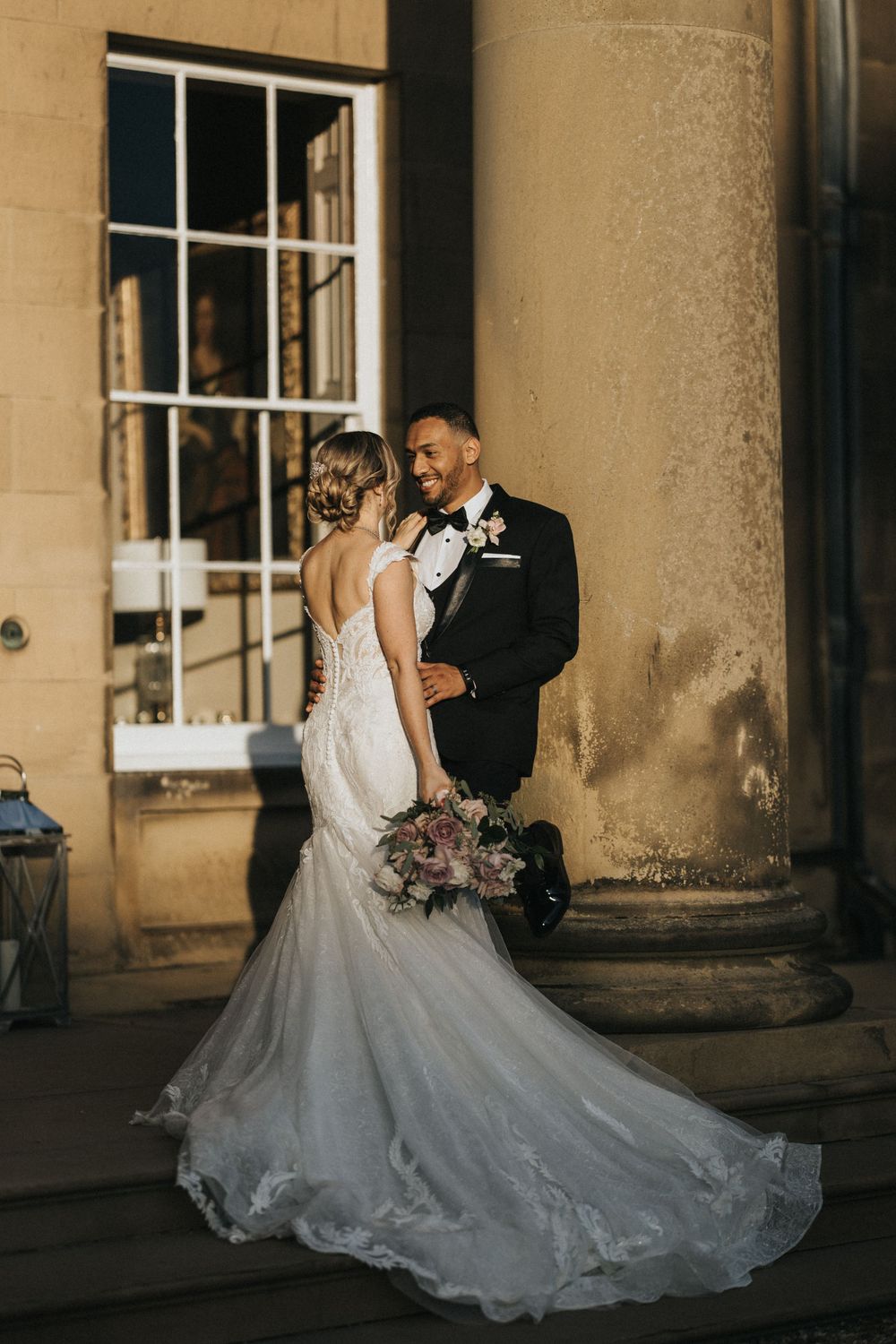 Wedding couple shares intimate moments together outside at Rise Hall during sunset. Taken by Grimsby photographers.