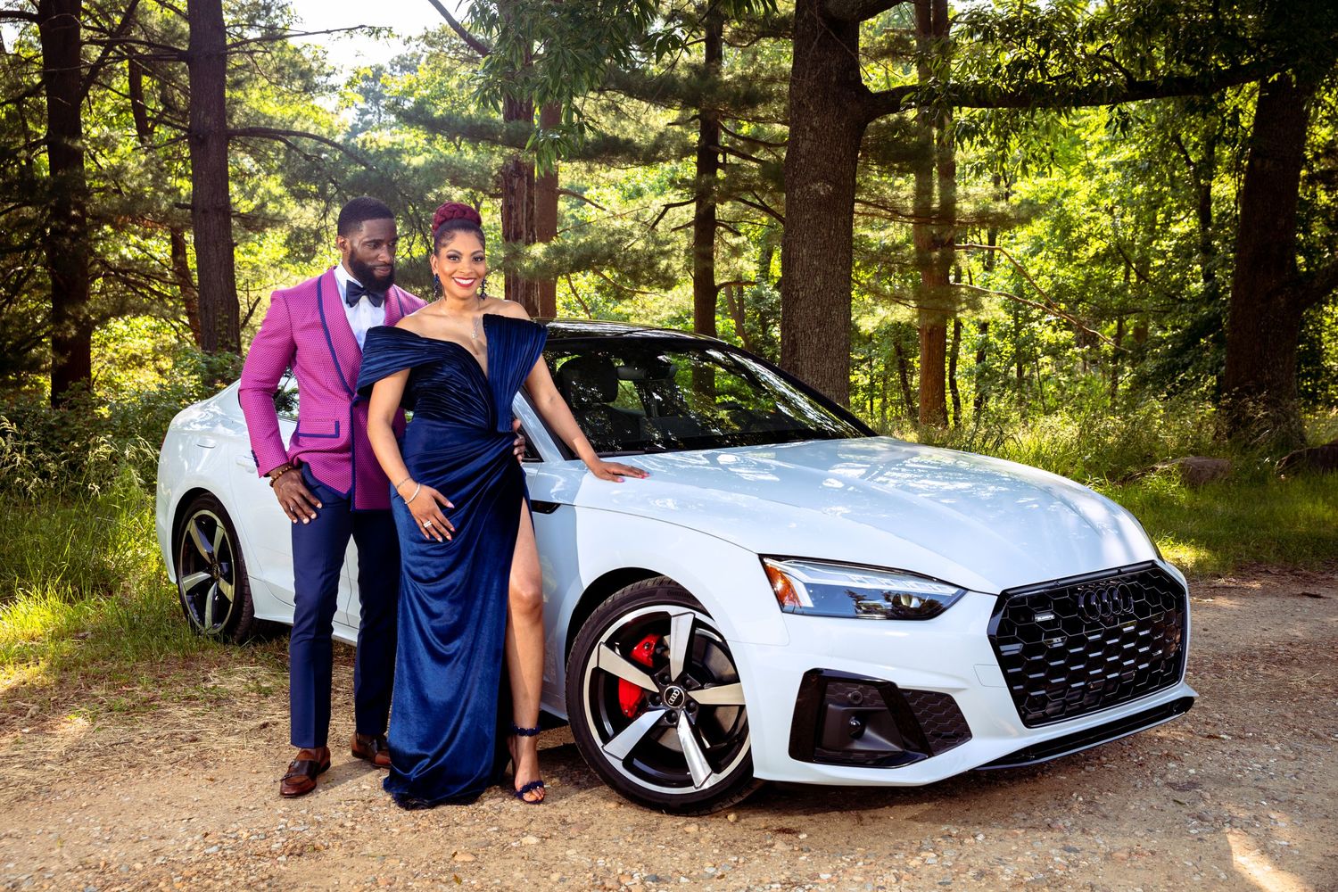 Luxurious white Audi sports car parked on forest road during formal photoshoot with Kyle Arrington and his wife Vashonda Murphy.