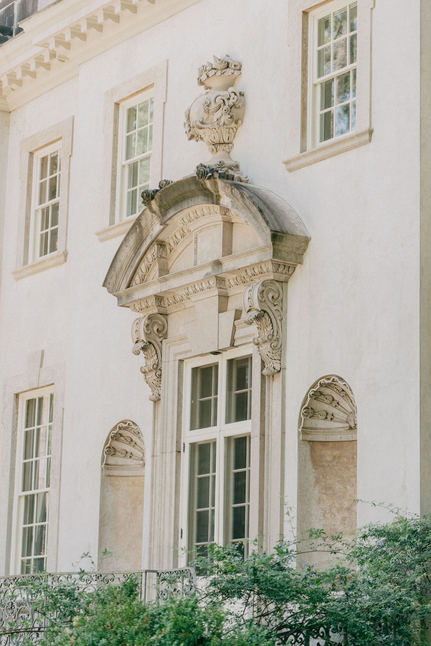 Detailed view of the windows at the Swan House, showcasing intricate architectural design and elegant craftsmanship.
