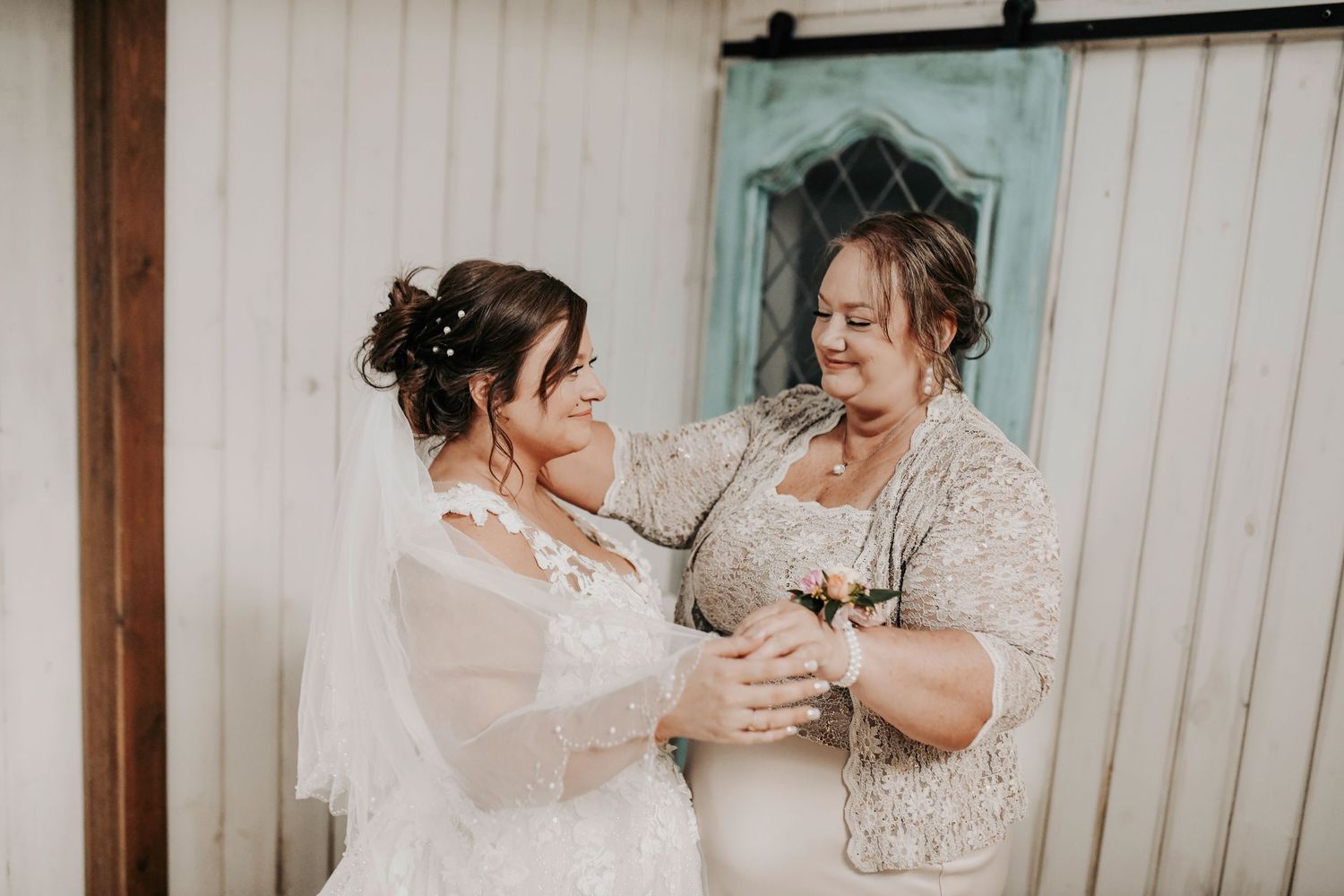 Emotional moment as bride’s mom carefully places her veil