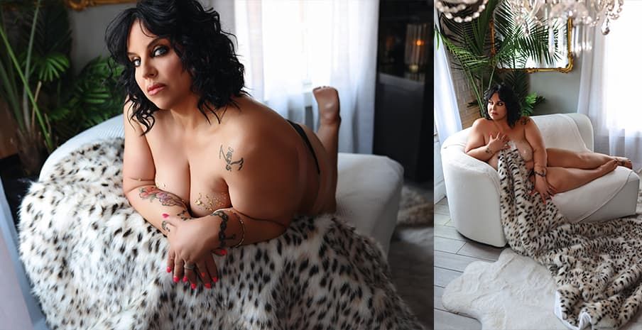 Professional boudoir photography session in soft natural light against elegant white bedding and decor.