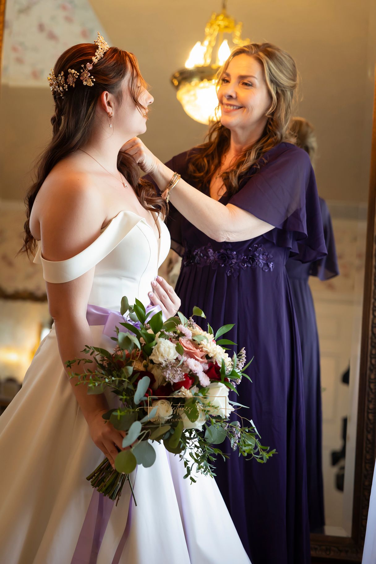 mother of the bride fixing bride hair