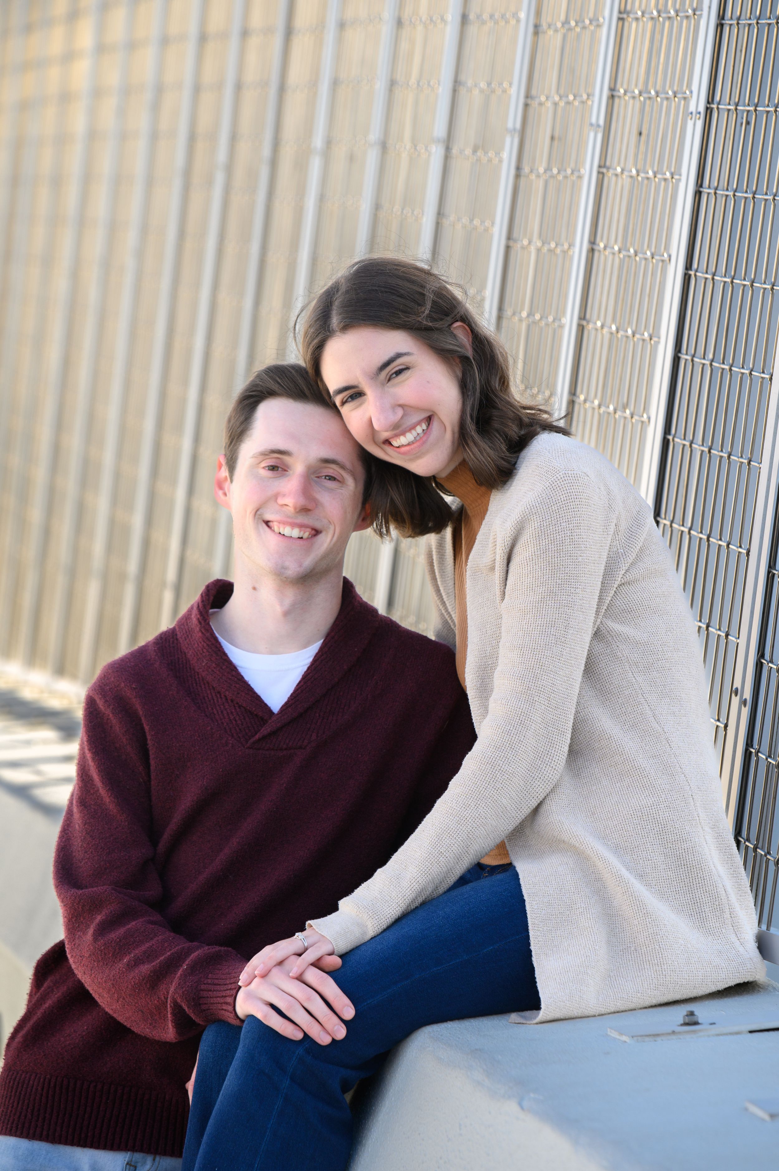 A couple sitting close together wearing maroon sweater and beige sweater in a multi-panel photo series.