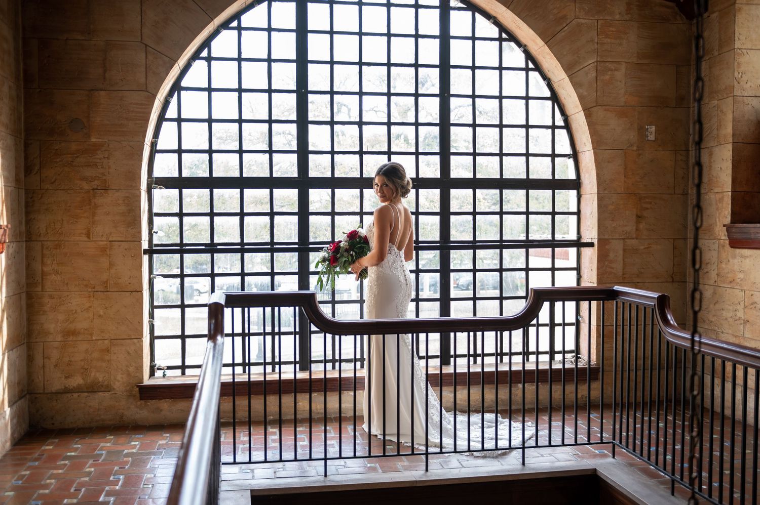 South Florida wedding photographers capturing the first kiss on a balcony overlooking St. Augustine’s waterfront at sunset.