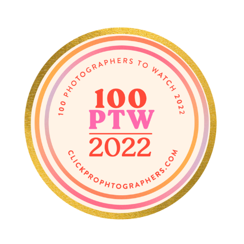 A circular badge design showing '100 PTW 2022' with pink and orange text surrounded by gold metallic border rings.