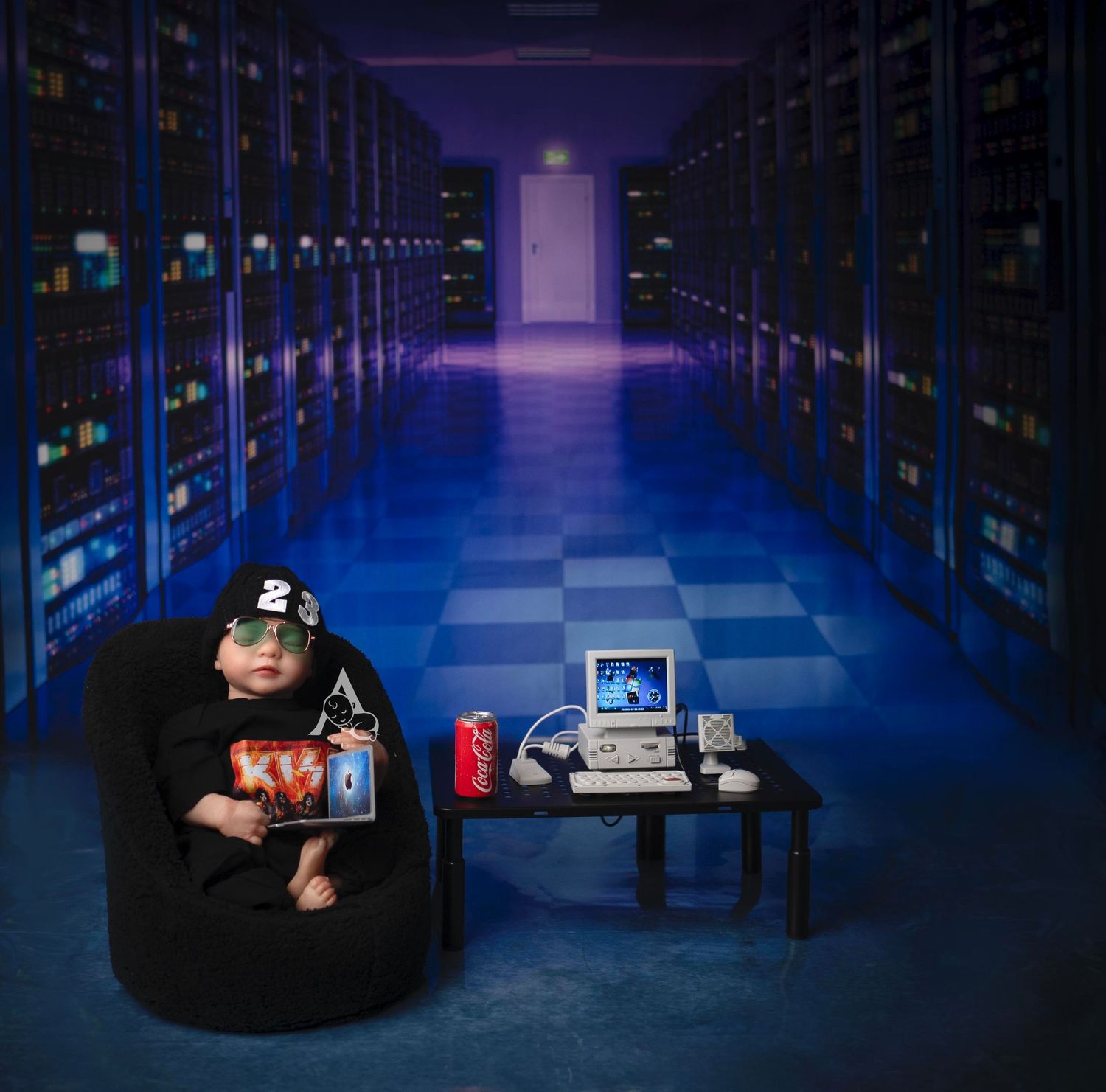 Dark server room setup with gaming chair and computer equipment in moody blue lighting.