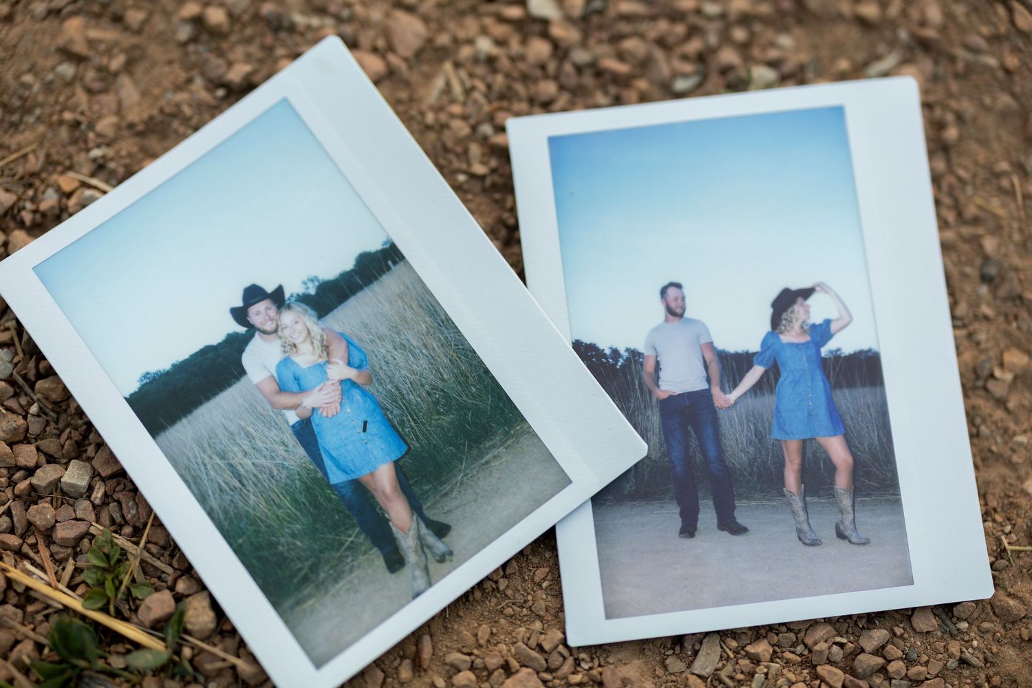 Two vintage Polaroid-style photographs lying on brown soil showing people outdoors in blue clothing.