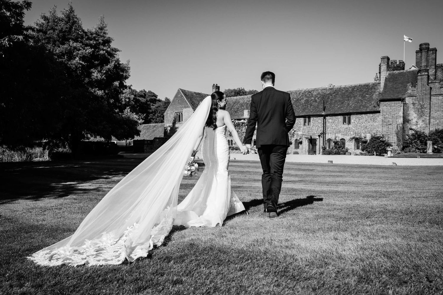 Wedding Photographer in Kent Bride and groom walking hand in hand