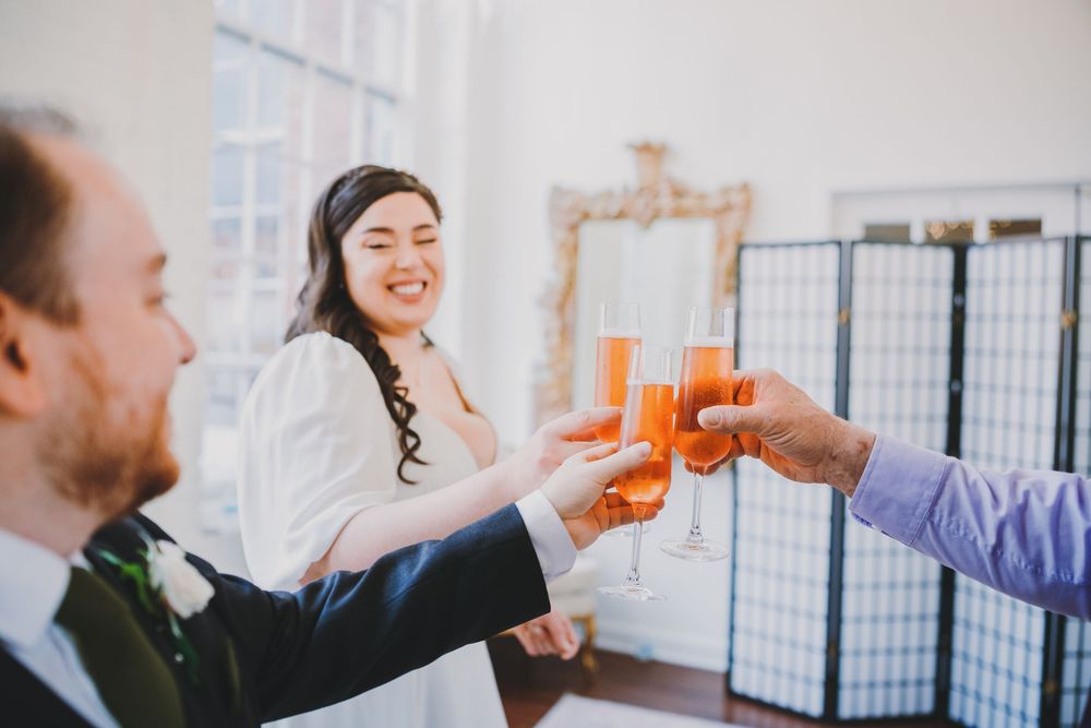 Matt and AnnaBelle's champagne toast at their micro wedding at The Rosebud in Savage, Maryland.