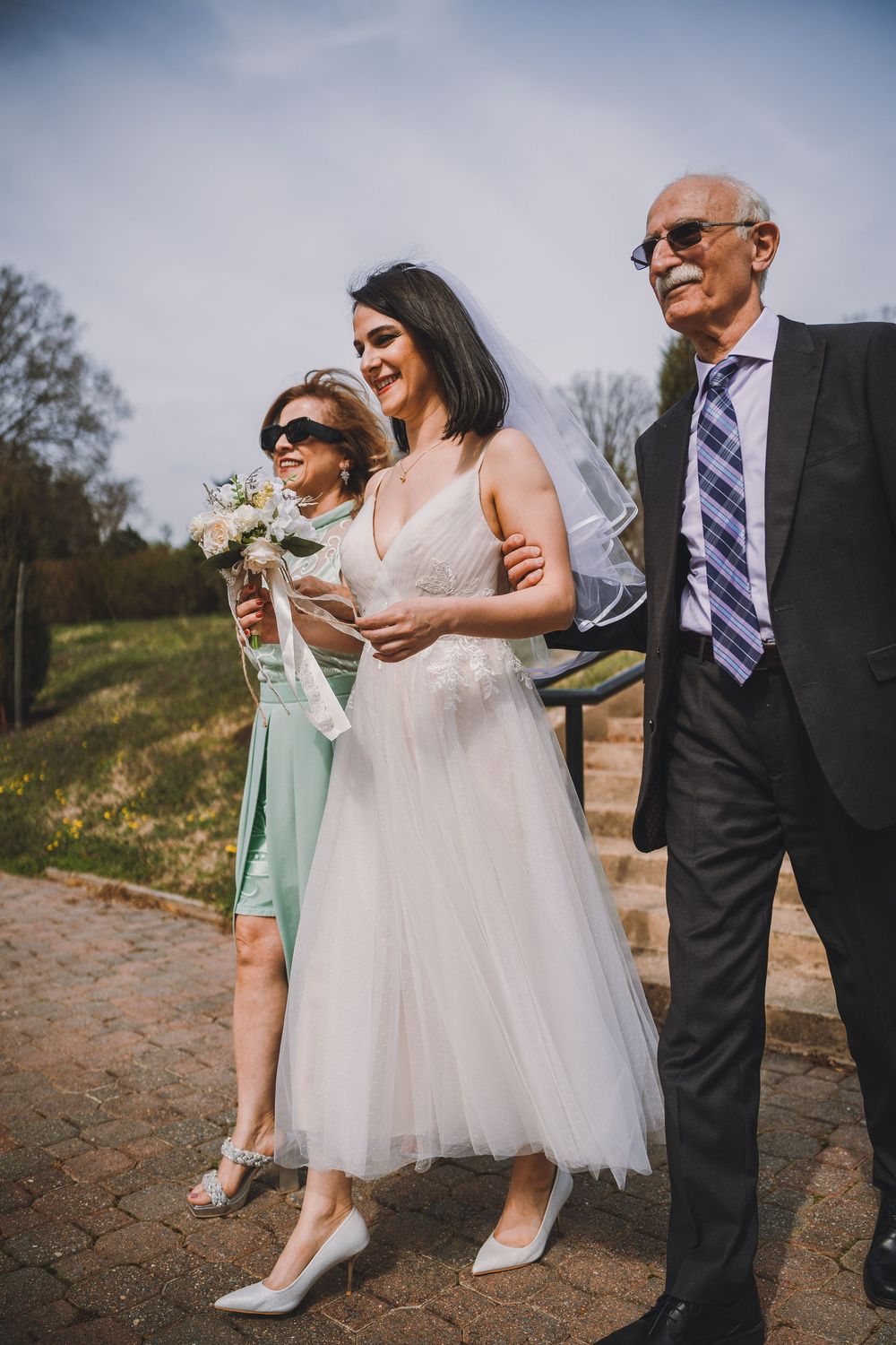 Saba walks down the aisle at her micro-wedding at Bon Air Park in Arlington, Virginia.