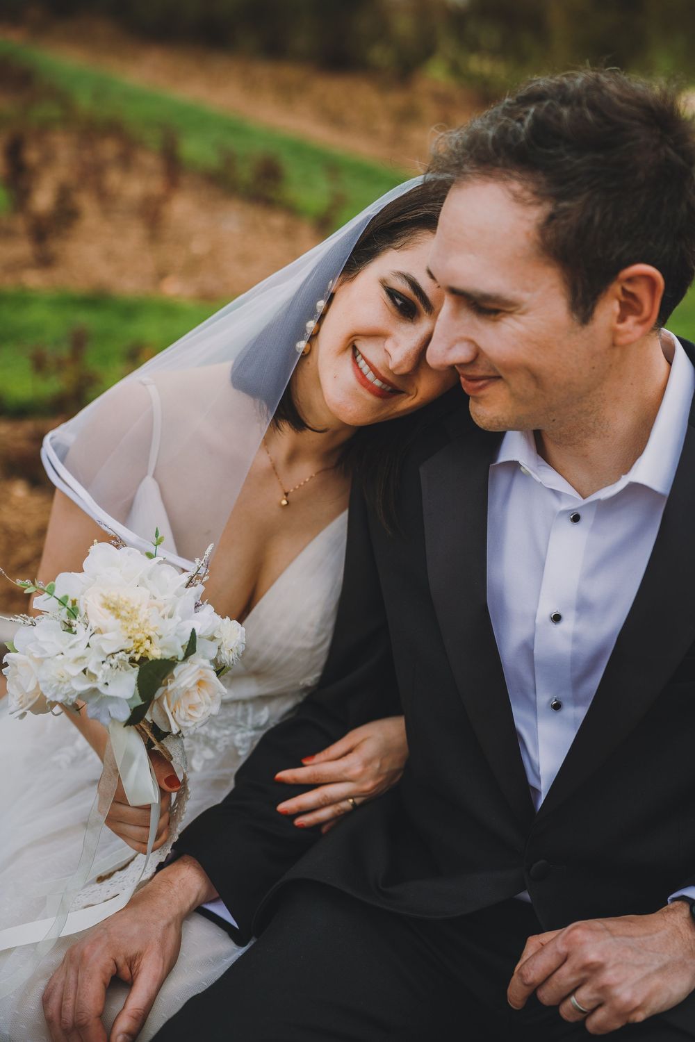 Javier and Saba embrace at their micro-wedding at Bon Air Park in Arlington, Virginia.