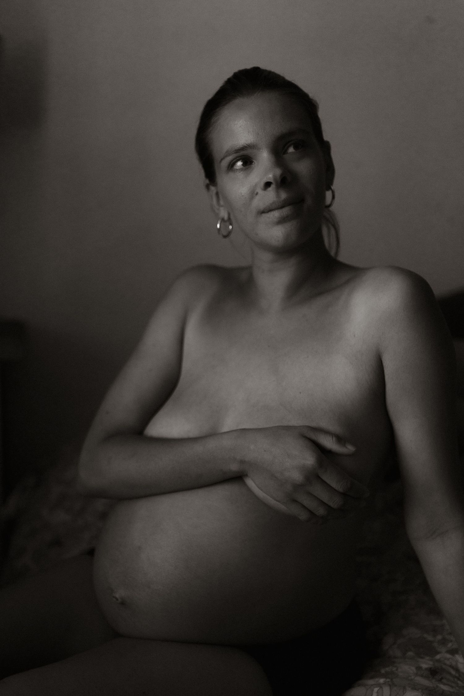Implied nude pregnant woman black and white