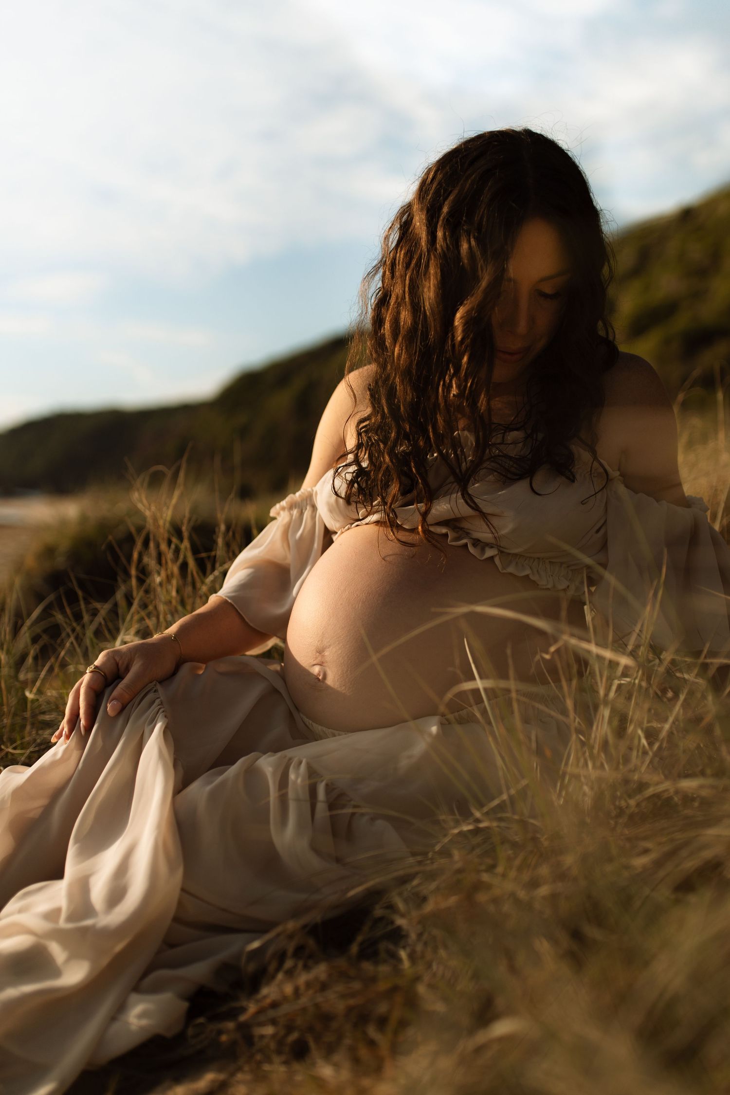 Sunrise maternity shoot in client closet dress