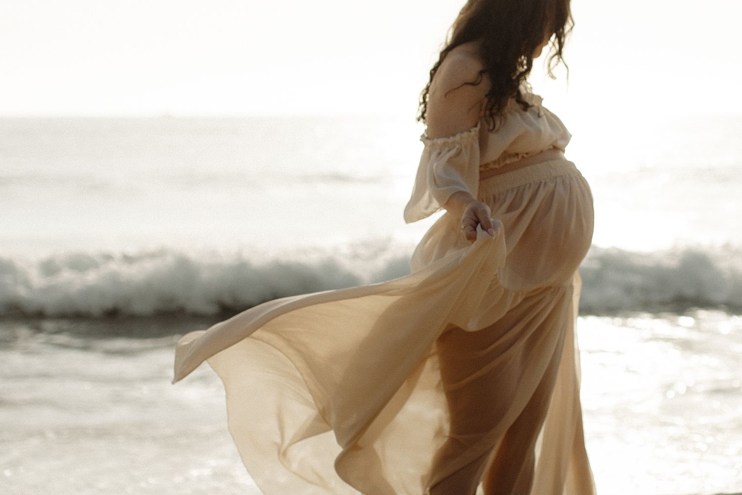 Sunrise maternity shoot in client closet dress
