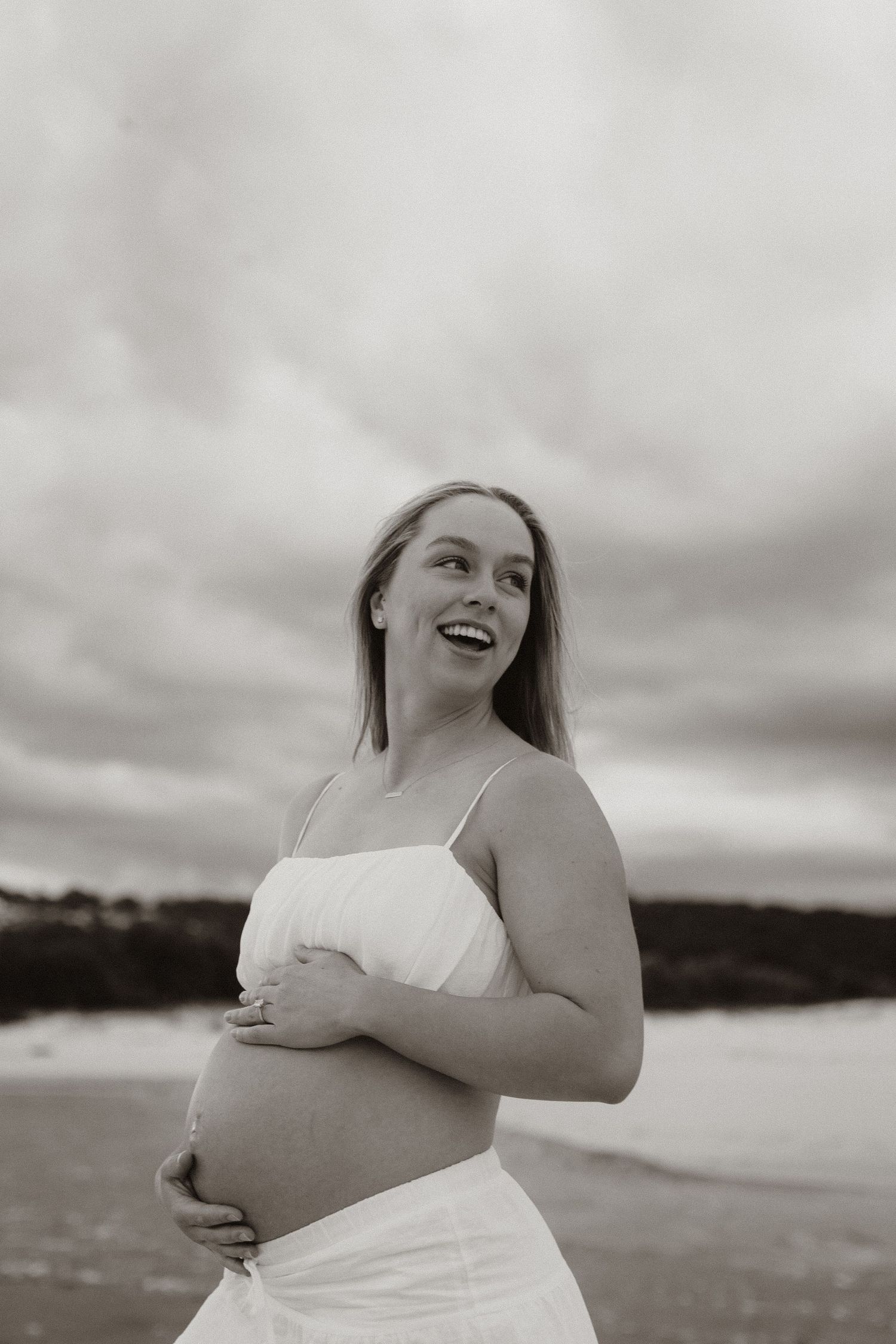 couples maternity session at the beach