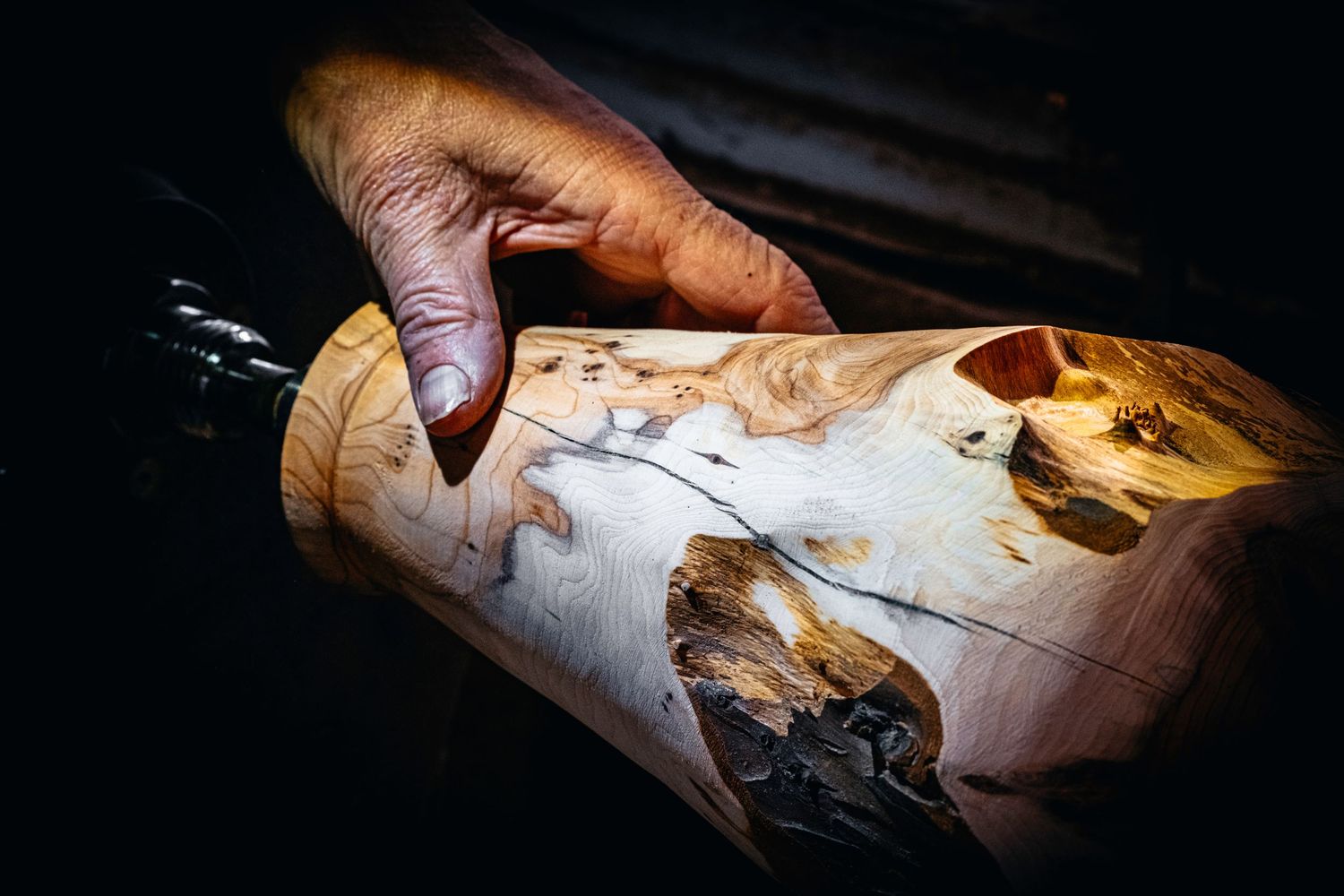 Image of a talented wood turner ready to begin crafting a vase on his lathe