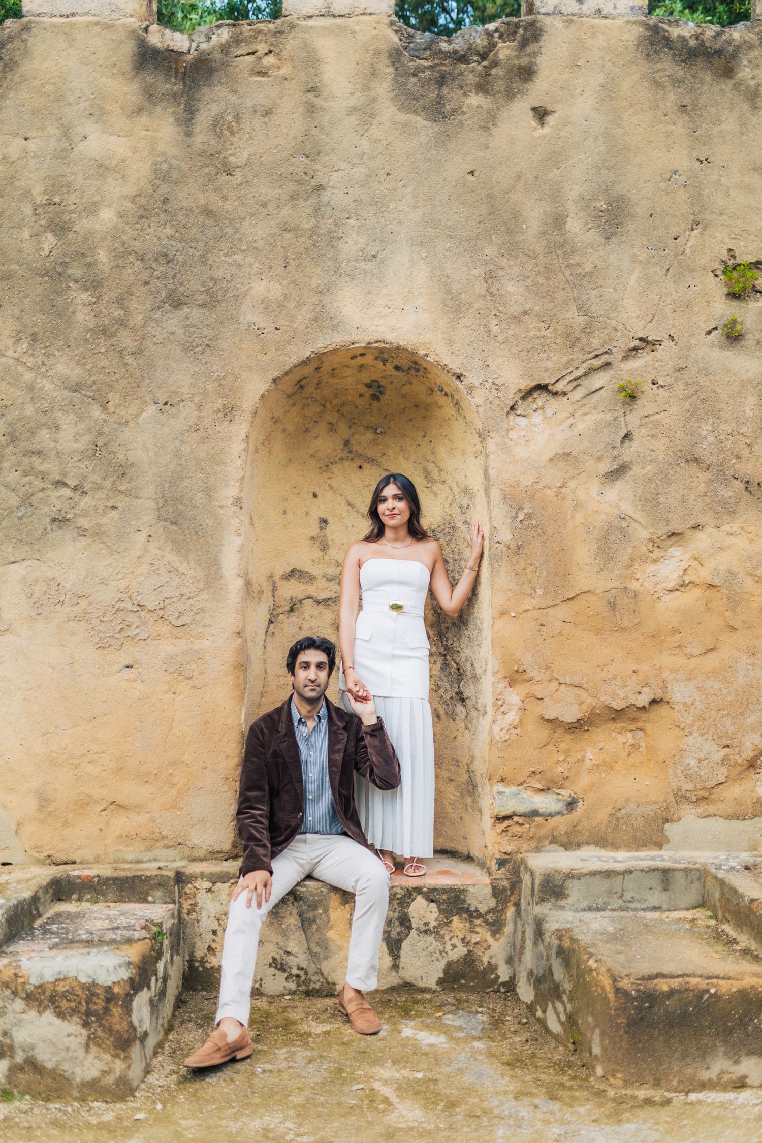 Romantic engagement photo-shoot in Sintra, Portugal, with an Indian couple exploring Penha Longa. By a destination wedding Photographer