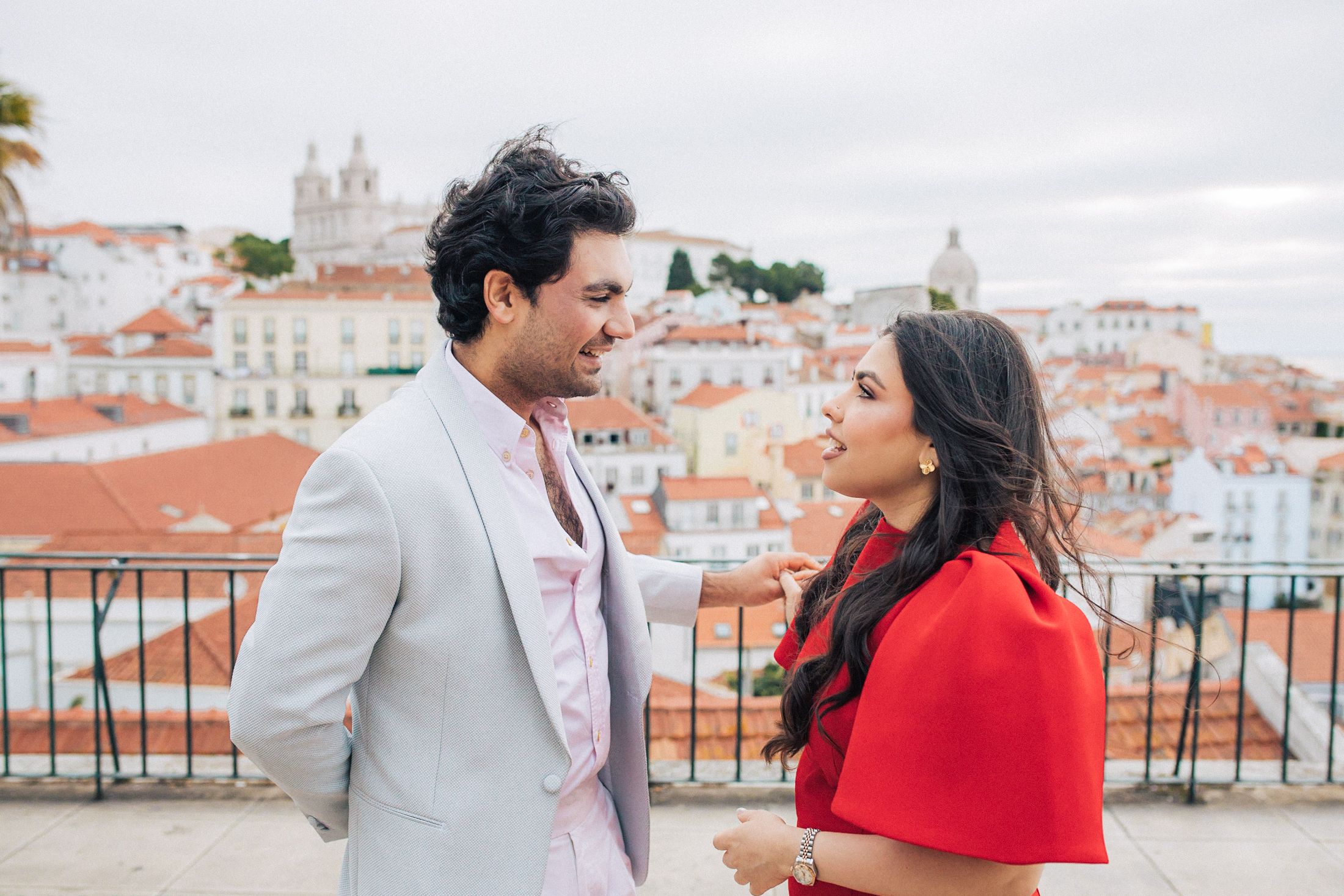 Romantic pre-wedding shoot in Lisbon with an Indian couple exploring historic city landmarks.