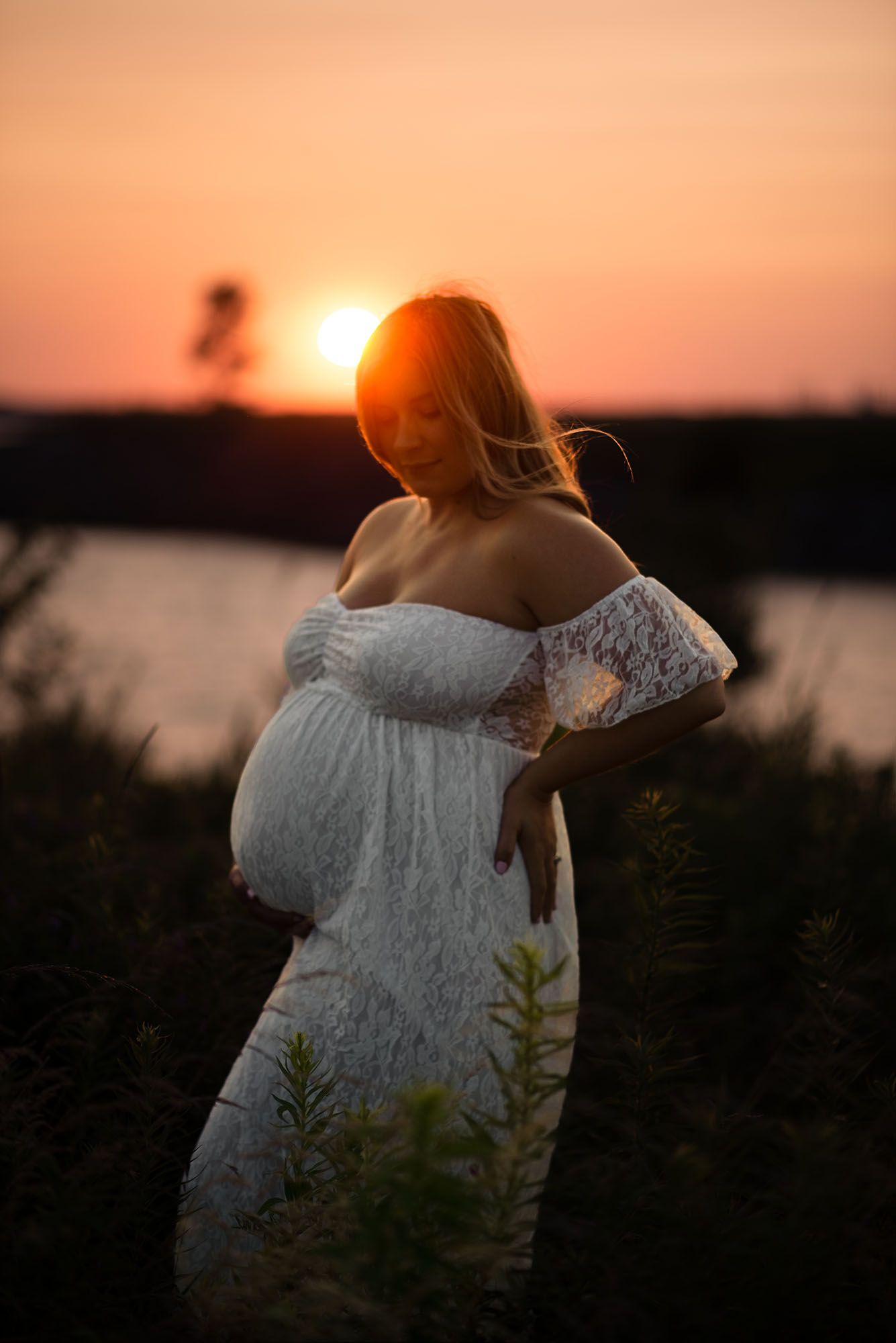 Maternity photography session during golden hour at Outer Harbor in Buffalo, NY