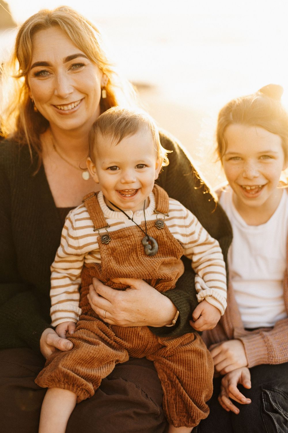 Candid sequence of playful moments with a small child wearing brown corduroy overalls and striped shirt.