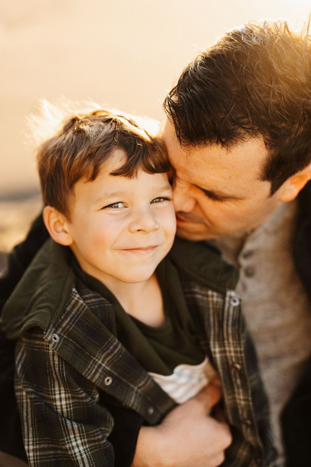 A heartwarming series of close-up shots showing tender moments of connection and affection between parent and child.