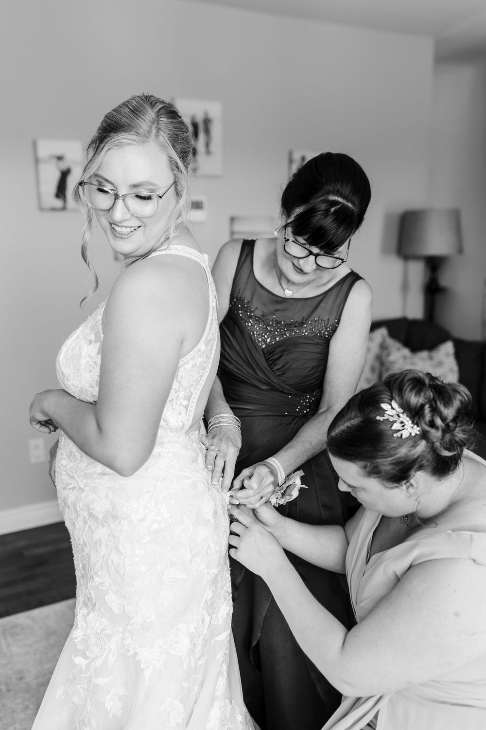 Wedding dress fitting and final adjustments shown in black and white photos.