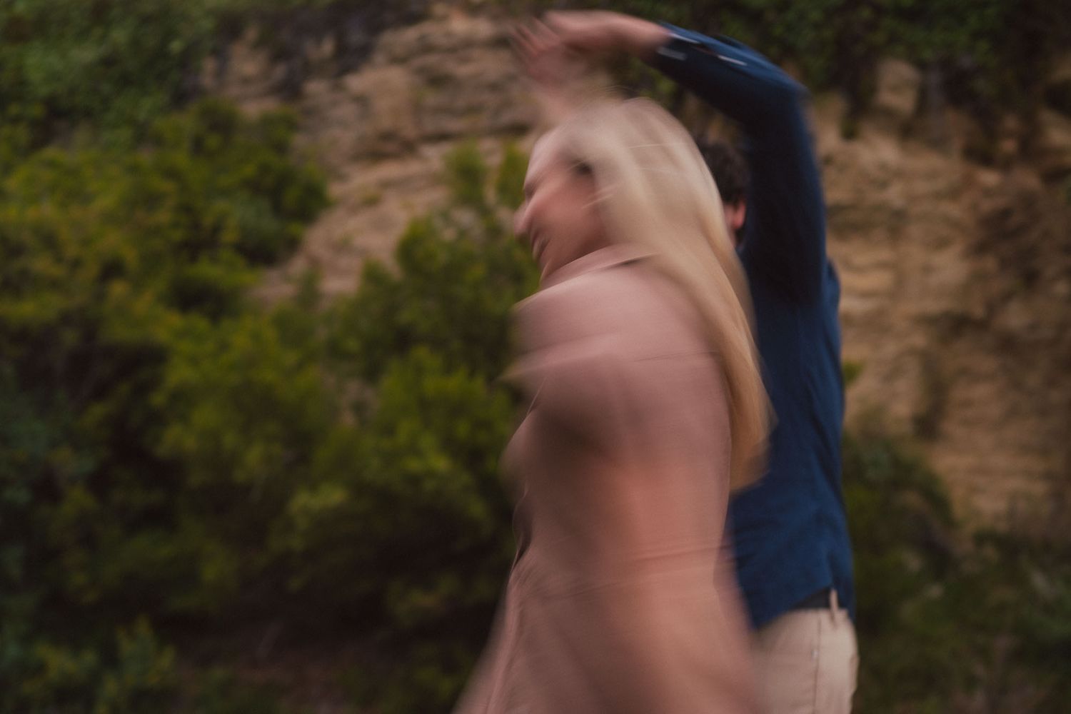 A series of blurred artsy motion shots taken against a rocky natural background in nature.