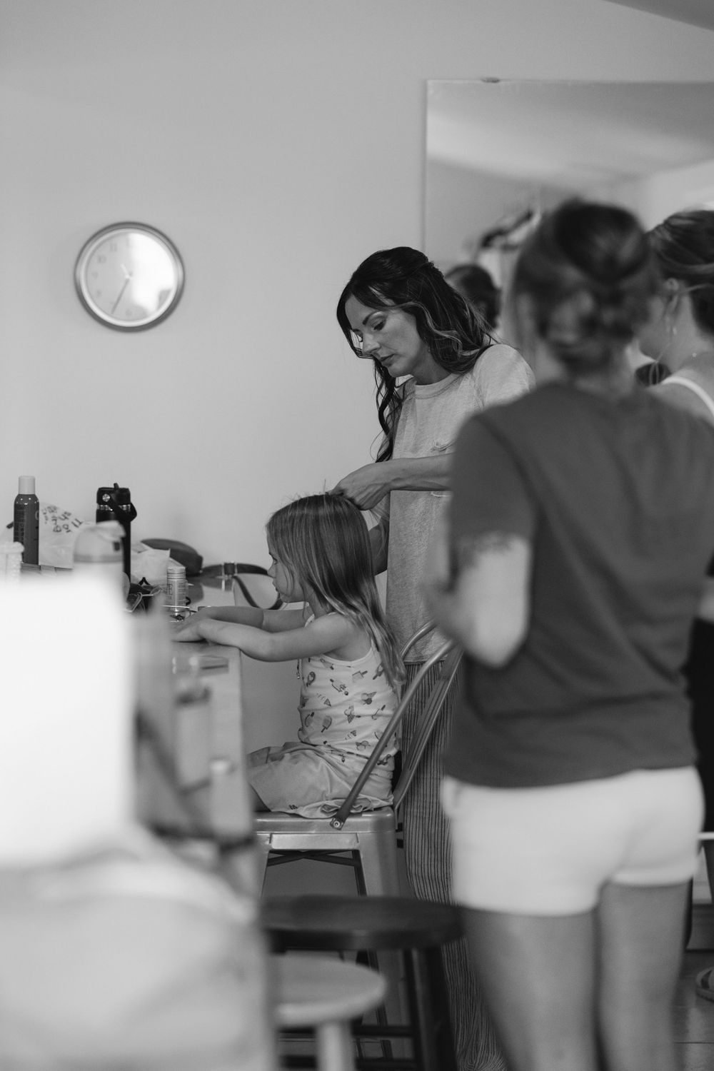 A group participates in a casual dance class inside a bright studio space.