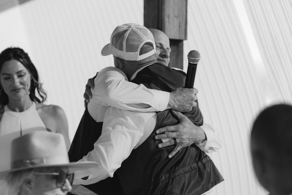 A black and white photo montage shows tender moments between couples in intimate embraces and dance poses.