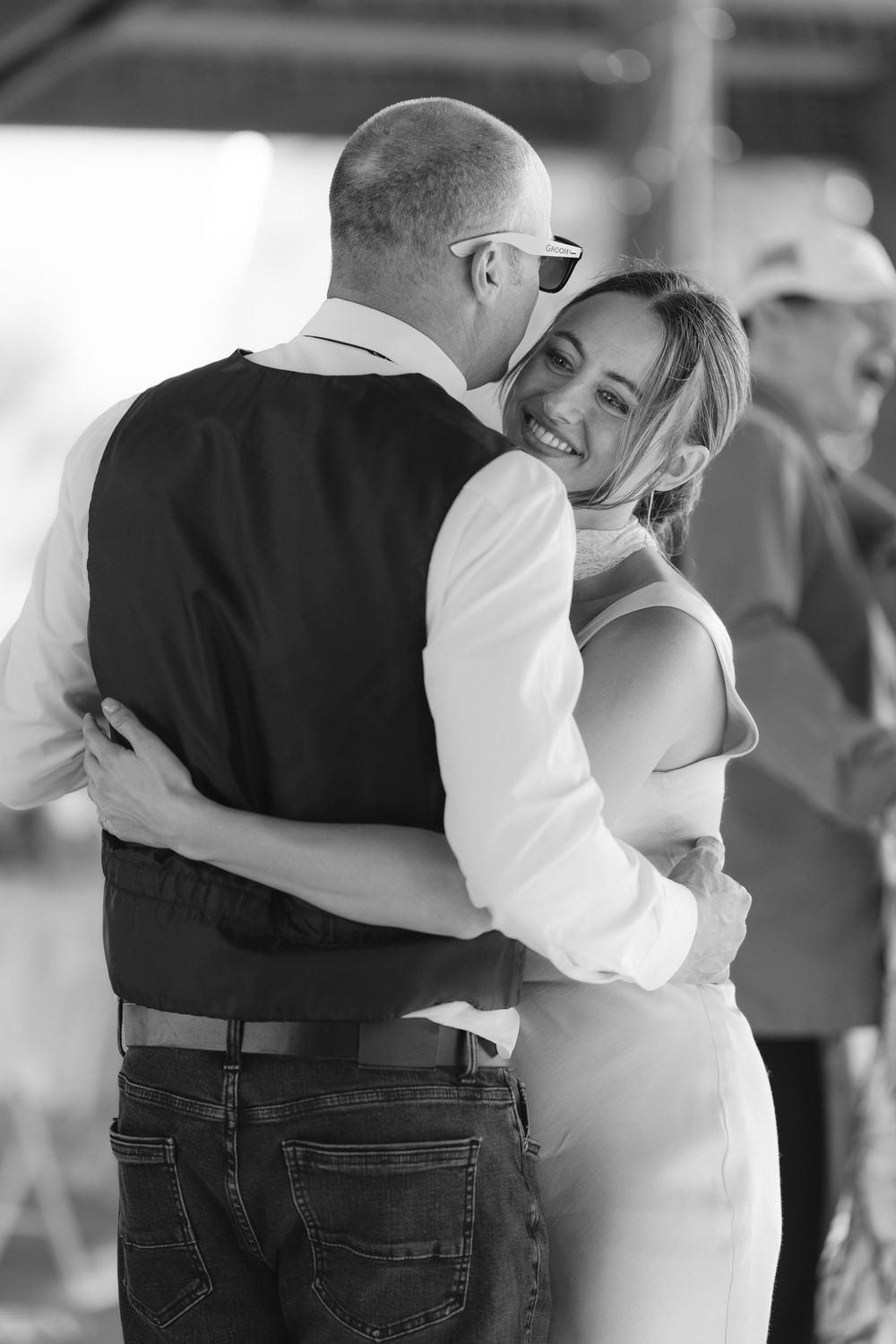 Black and white image showing intimate dance moments at a wedding reception.