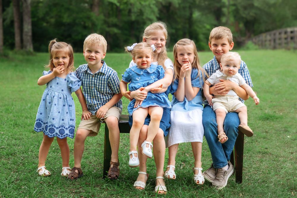 Children from extended family session smiling together during outdoor photoshoot in Athens GA