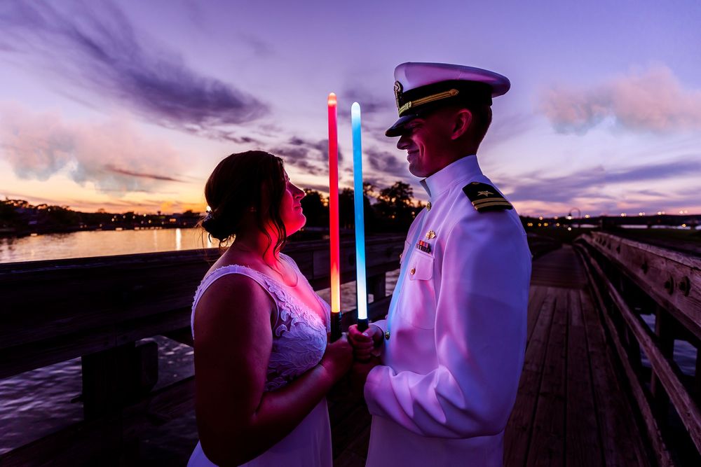 A romantic boat cruise at sunset features elegant dining and purple-tinted skies over the water.