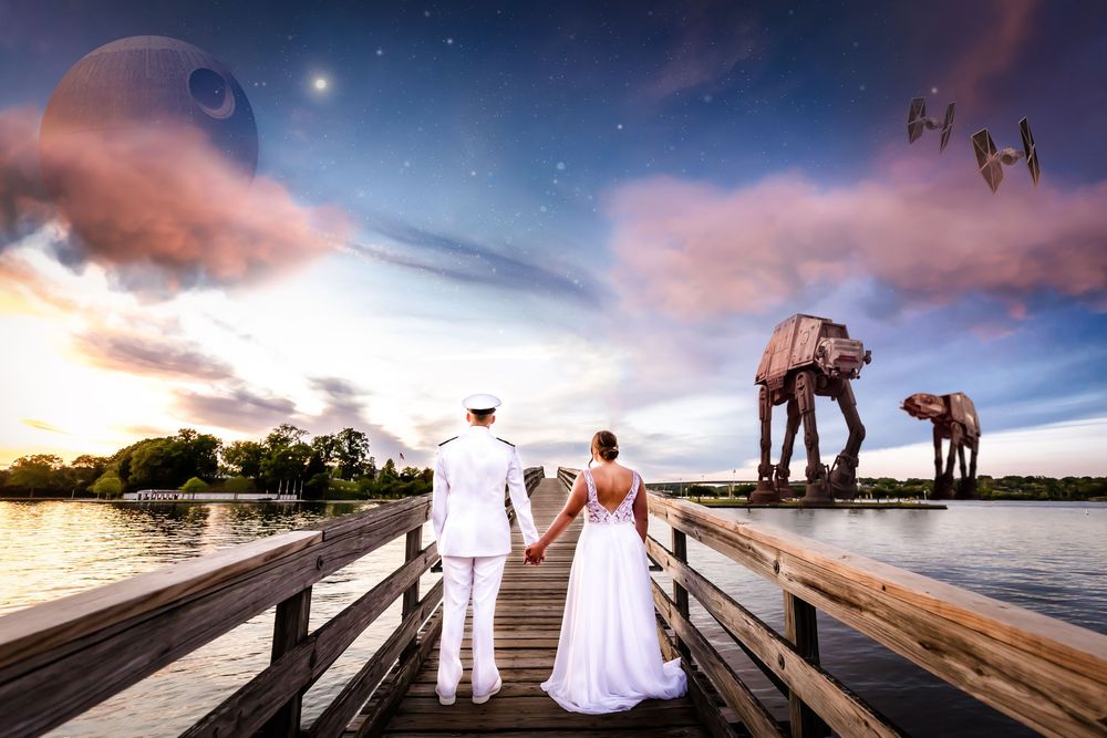 Couple on wooden pier at sunset with Star Wars AT-AT Walkers photoshopped into fantasy landscape background.