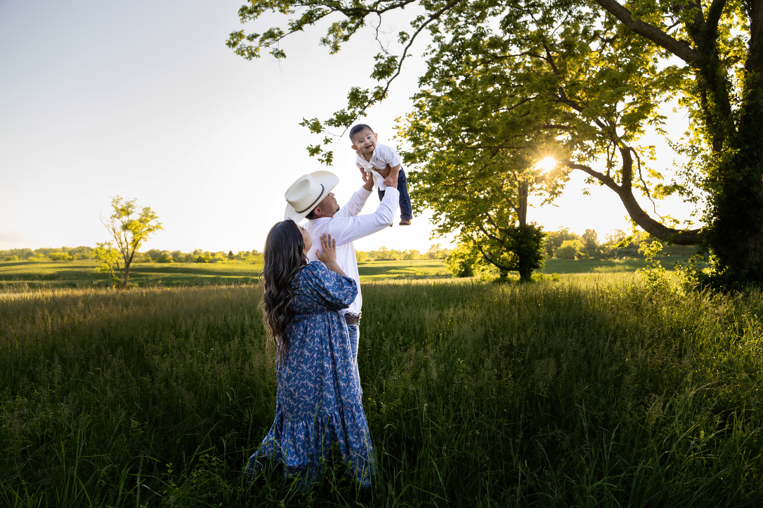 A golden hour maternity session in the Kentucky fields capturing a growing family’s love as they await their second baby boy, photographed b