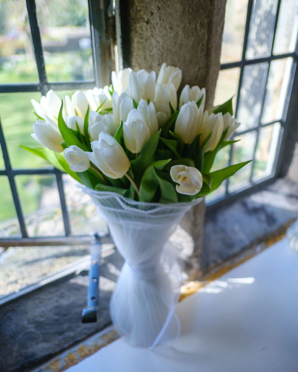 Bride bouquet on the window sill at Holdsworth House, Halifax