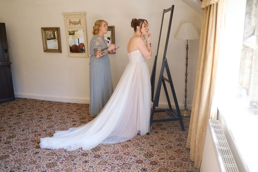 Bride and her sister preparing before the ceremony at Holdsworth House, Halifax