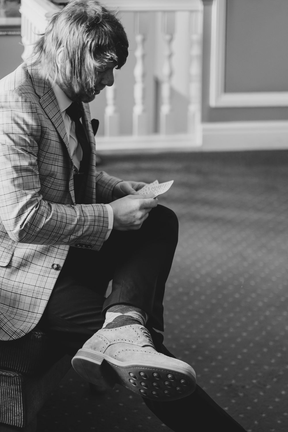 Best man reading his speech before the ceremony.