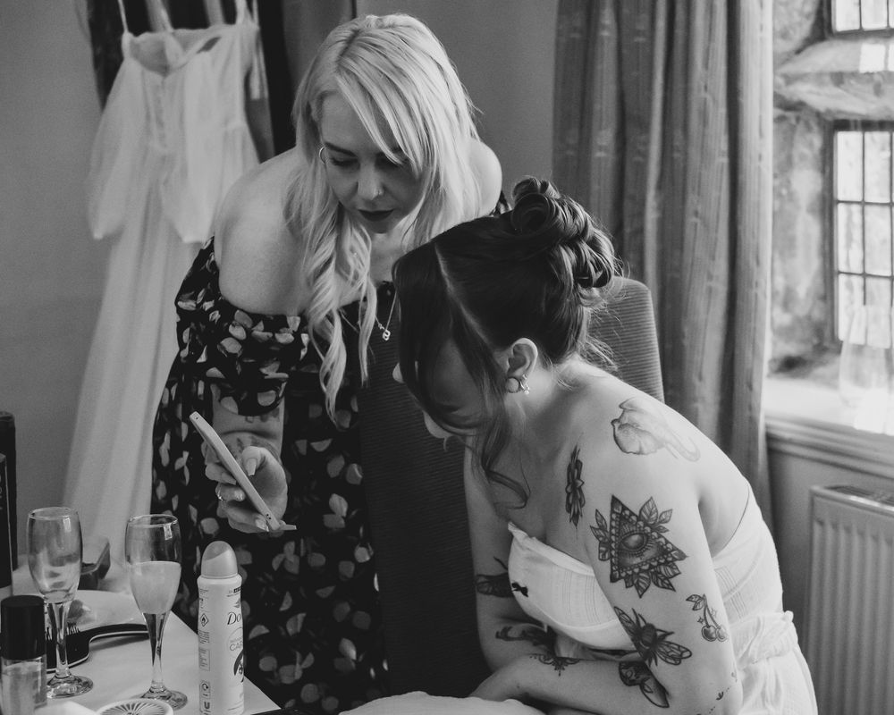 Bride with her hairdresser before the wedding ceremony at Holdsworth House, Halifax