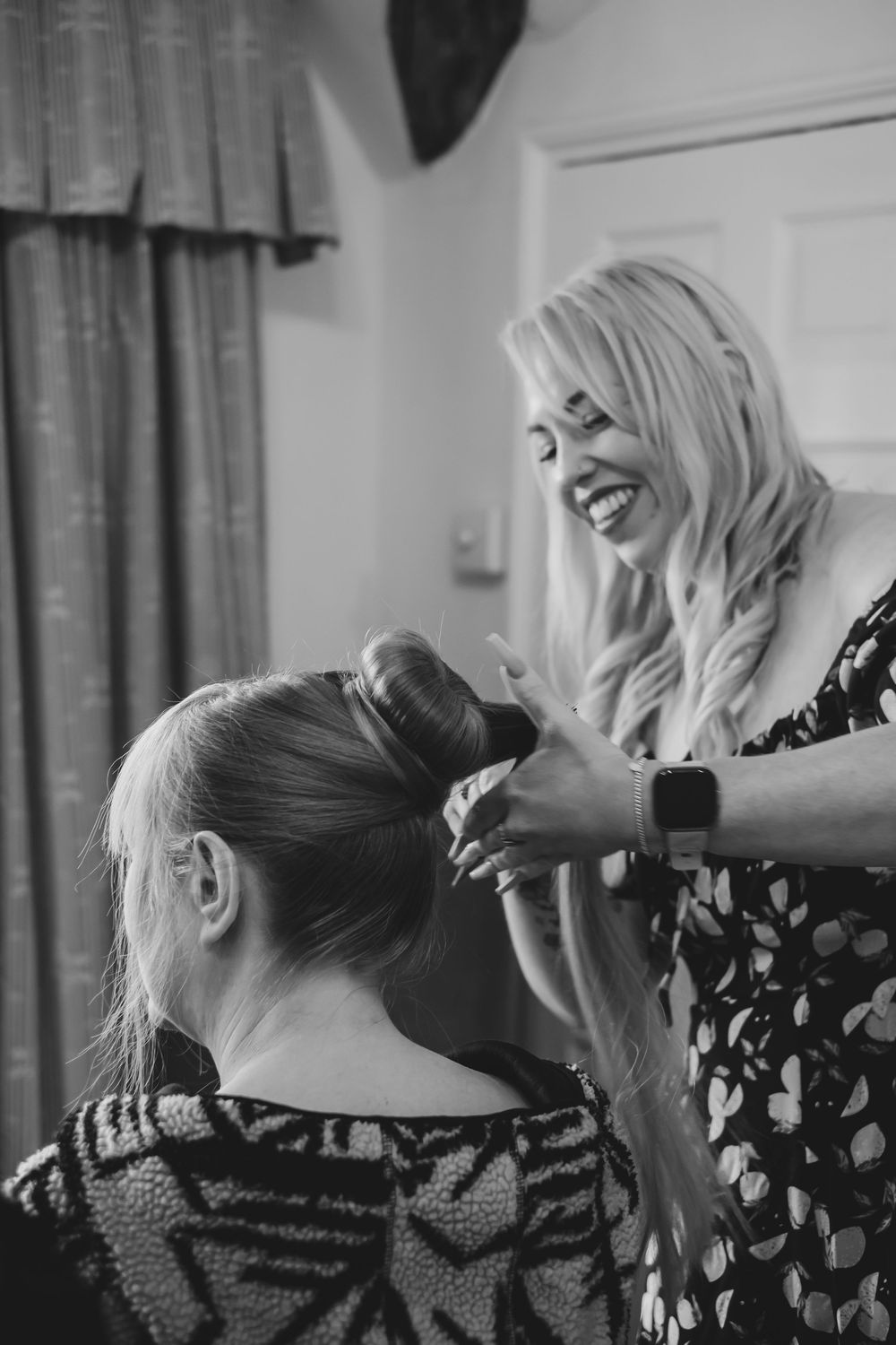 Brides mum having her hair tied up by the hair dresser at Holdsworth House, Halifax