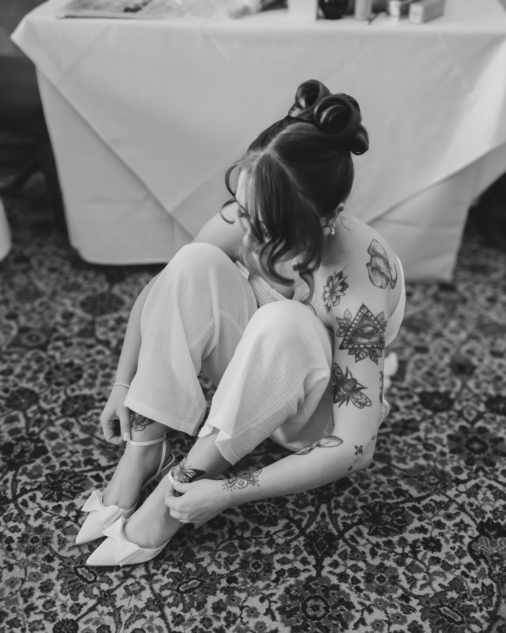 Bride putting on her shoes before the ceremony.