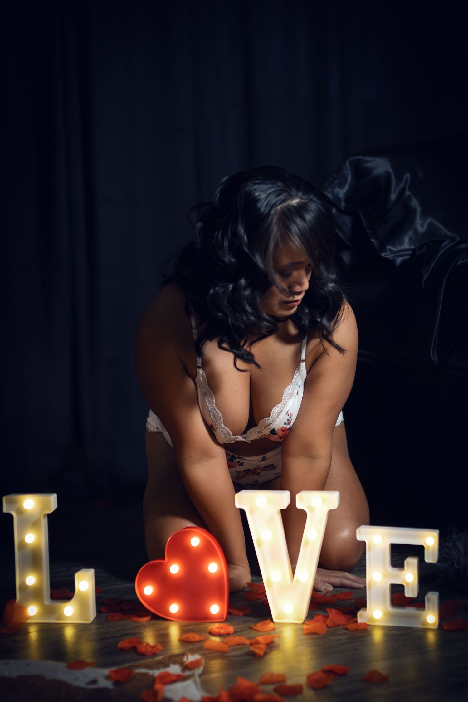 Valentine's- inspired boudoir photo with LOVE lights by DFW boudoir photographer Lock and Key Photography.