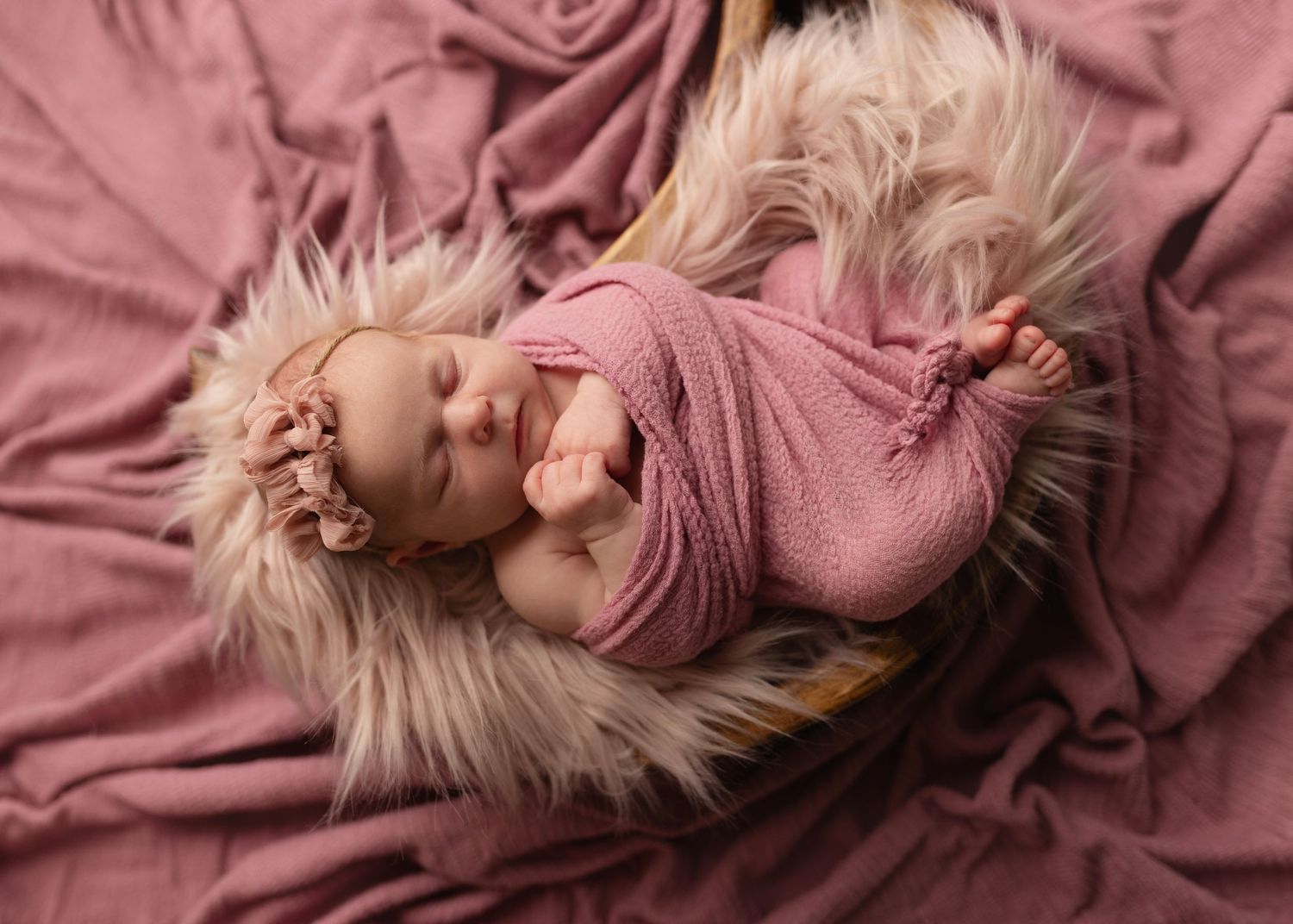 Newborn in a pink moon bowl during her sleepy newborn photos. Elizabeth Lang Photography session Cloverdale.