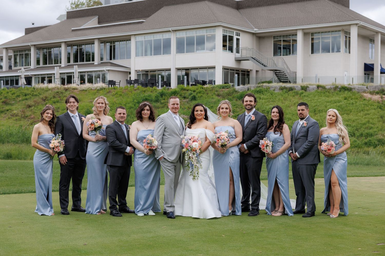 Wedding party portrait in front of clubhouse at Islington Golf Club Toronto