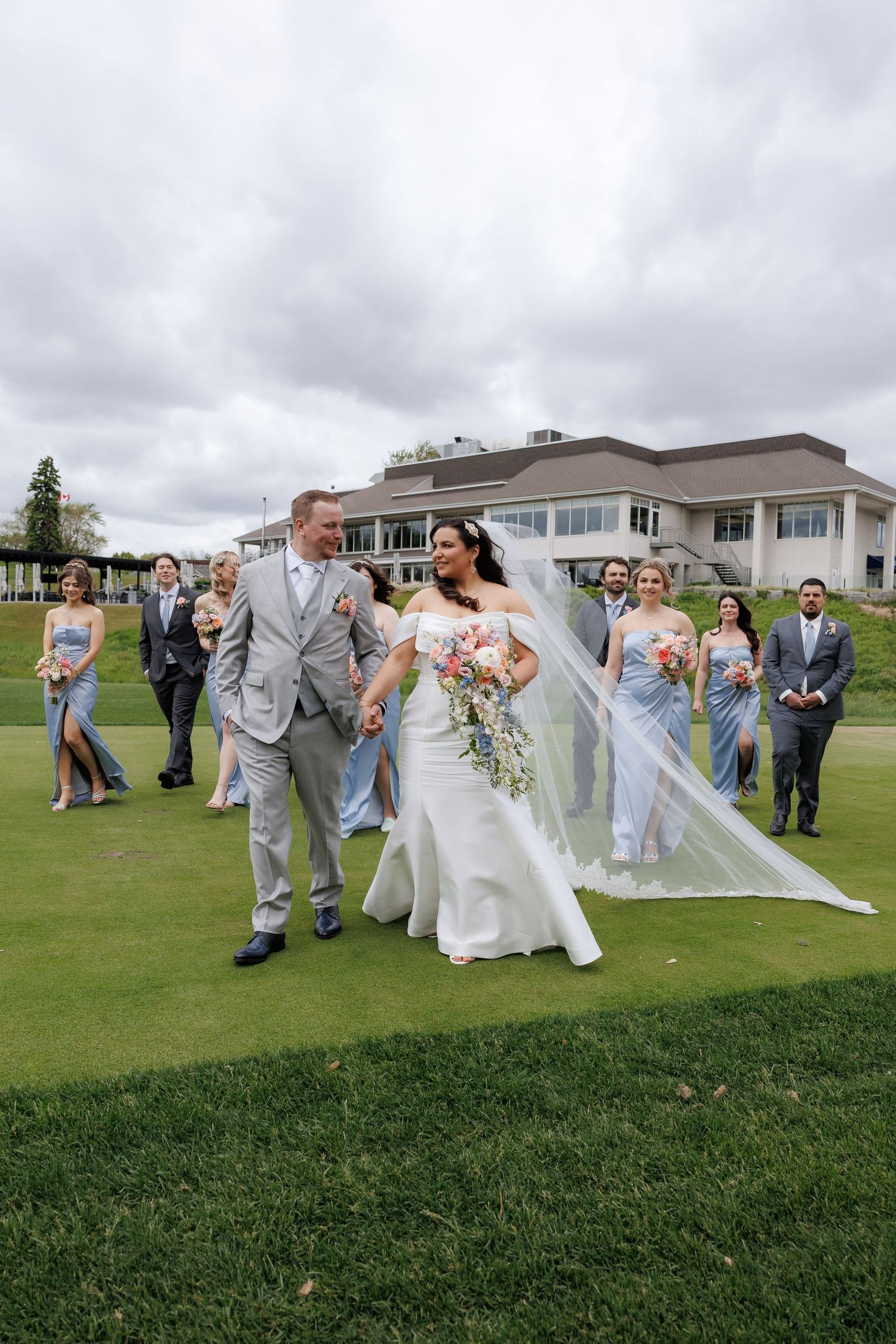 Wedding party photos in front of clubhouse at Islington Golf Club Toronto